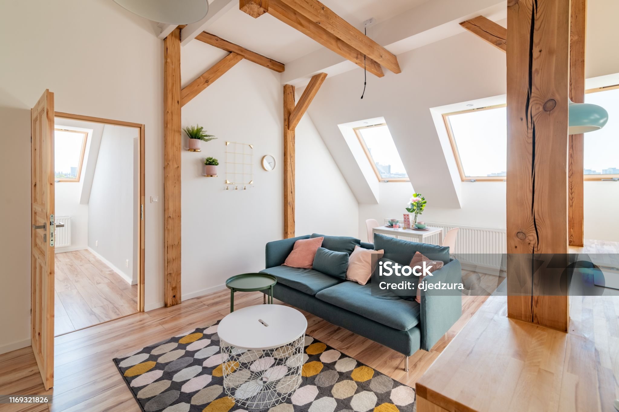 Modern bright living room with textile sofa in loft apartment